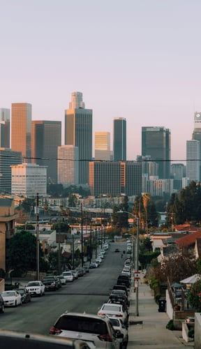 Los Angeles downtown skyline at dusk seen from a residential street